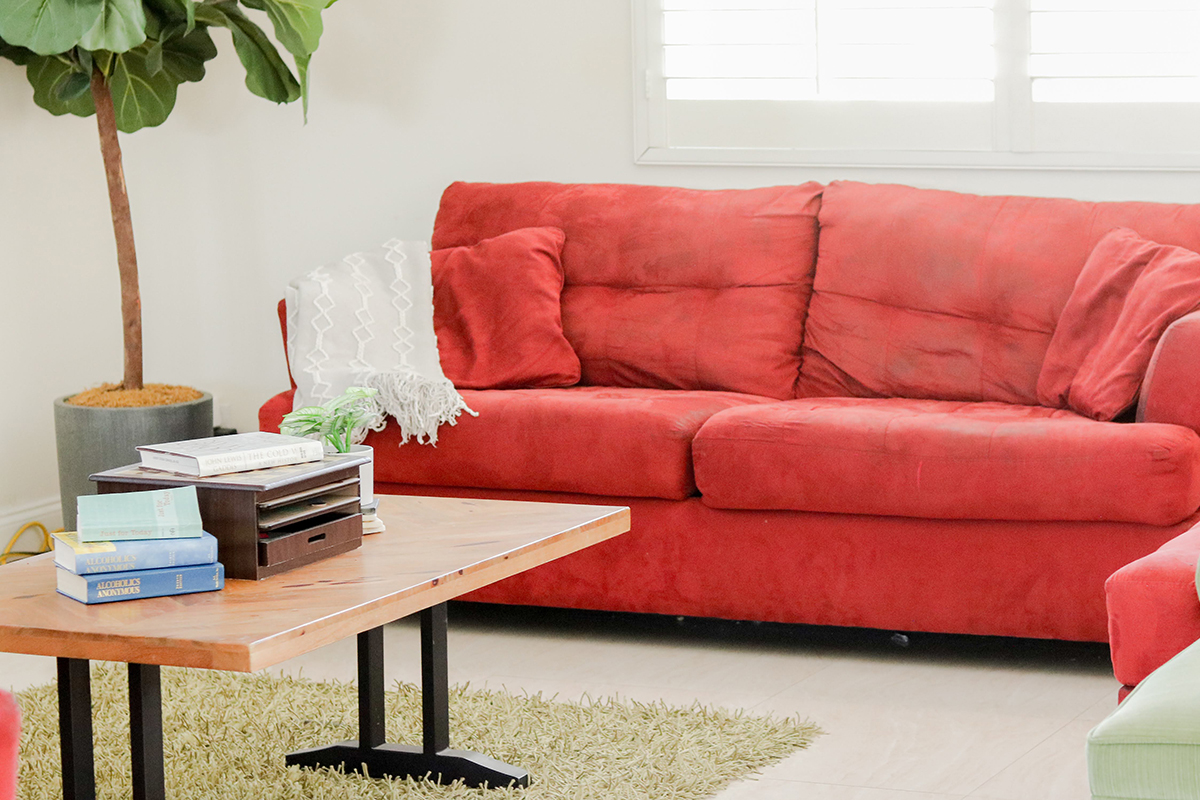 red couches surround a coffee table