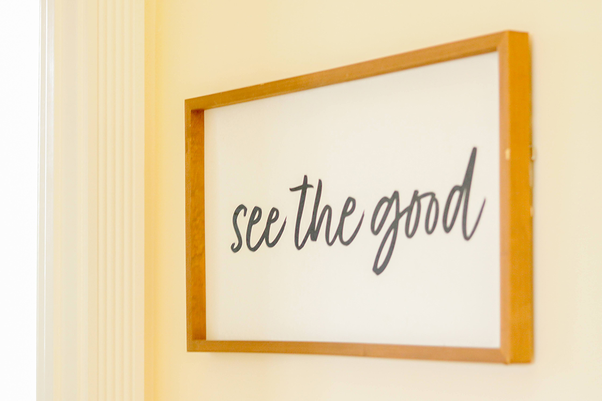 art on a wall that reads "See the Good"